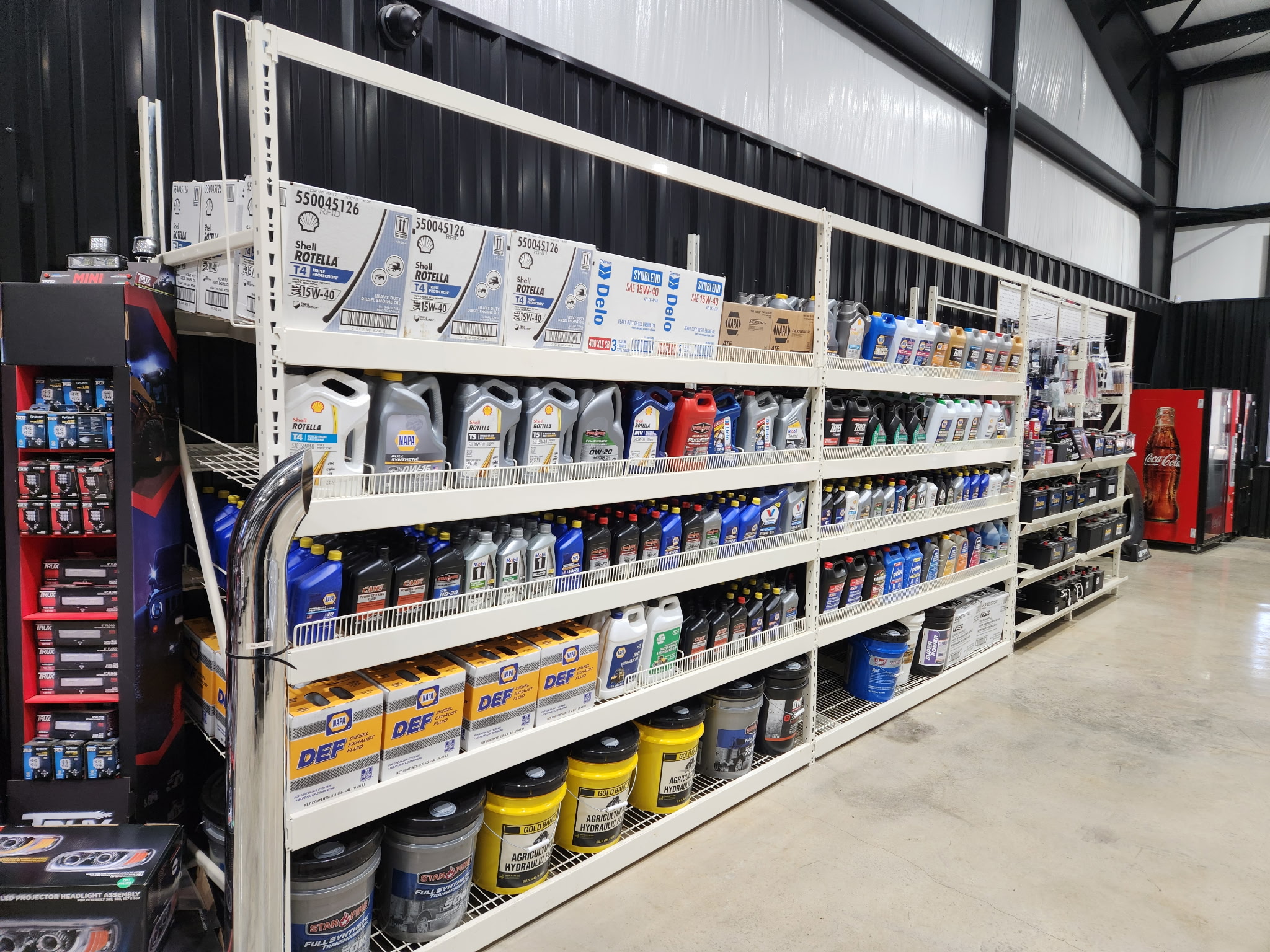 Diesel oil, DEF, and big-truck parts stocked on shelves at Wilkerson's parts counter in Jackson, MS